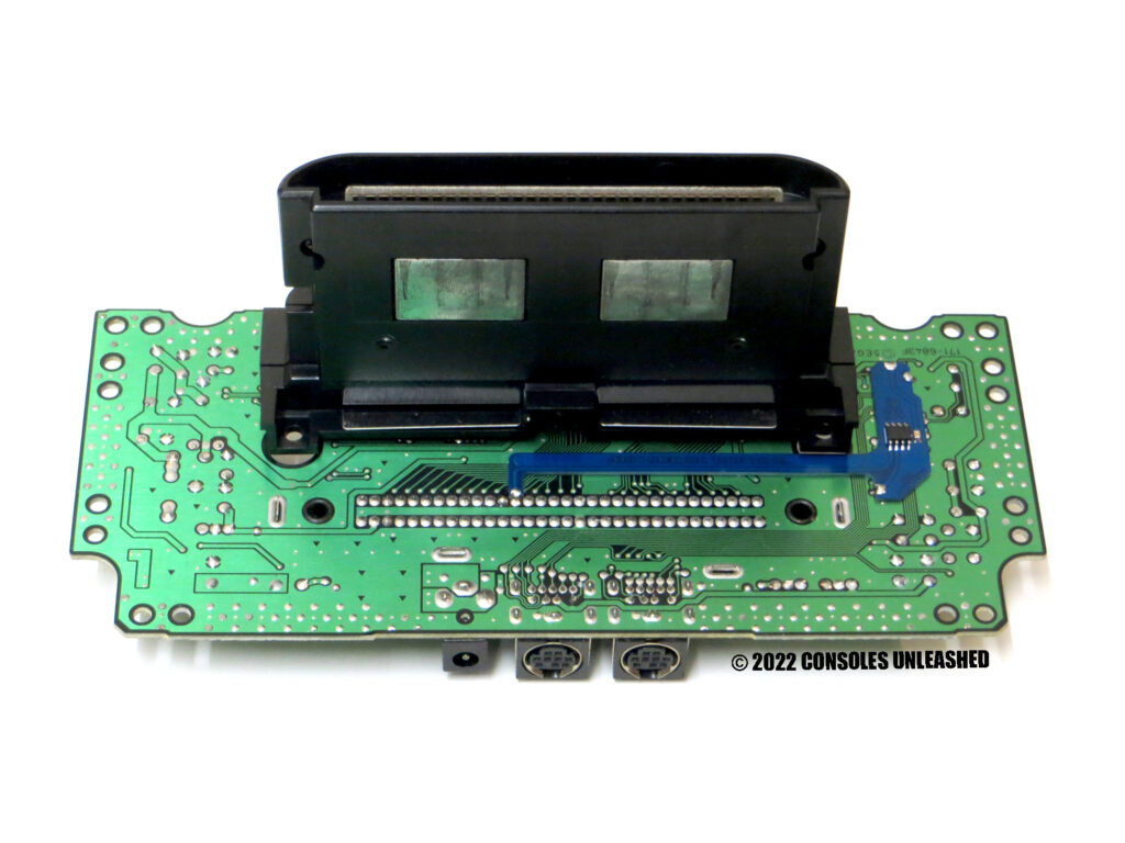 Full bottom side PCB showing Sega 32X Auto Hertz No Wire Quick Solder Board mod kit installed. Straight on.