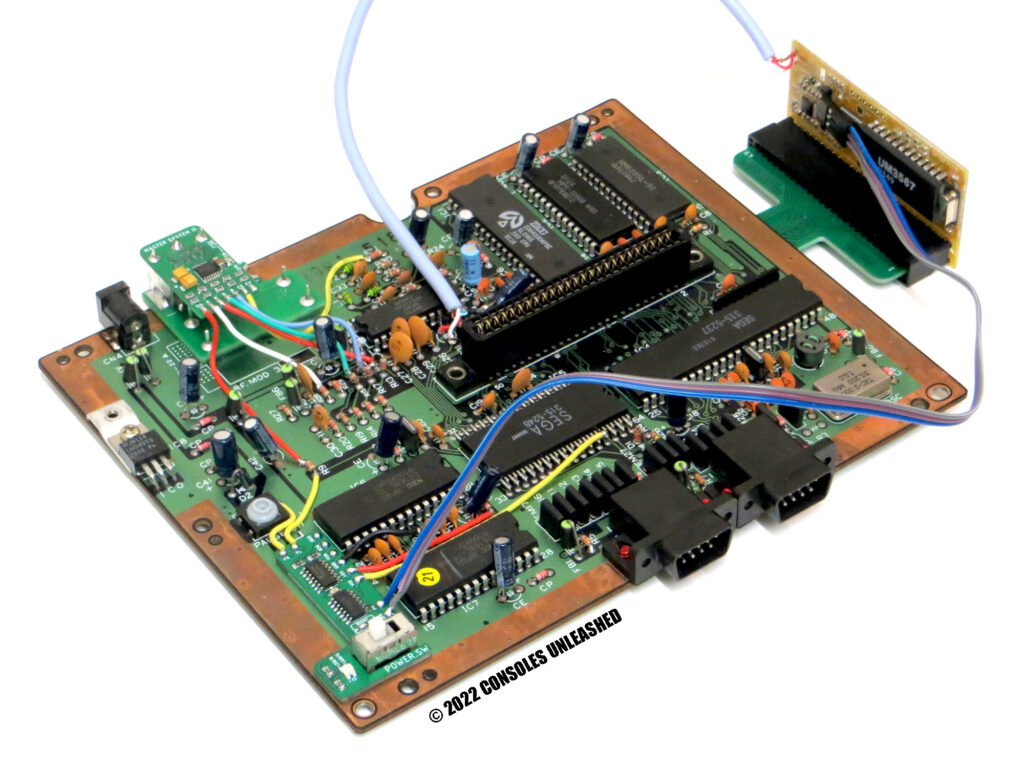 Top side of full Master System 2 PCB showing lots of installed mods. Switchless region, RGB video, and FM Sound Module with FM Sound Module Adapter.